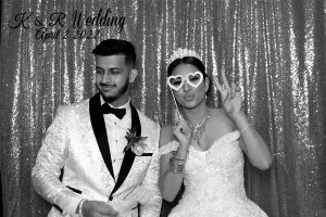 bride and groom using a photo booth in vaughan